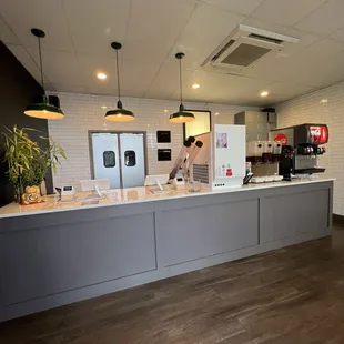 a kitchen with a counter and a refrigerator