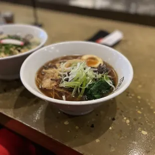 two bowls of soup on a table