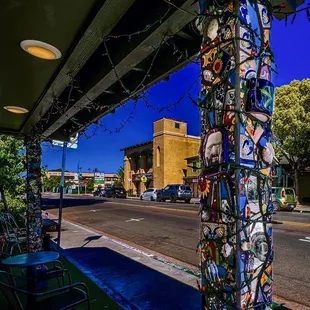 a street corner with a colorful pole