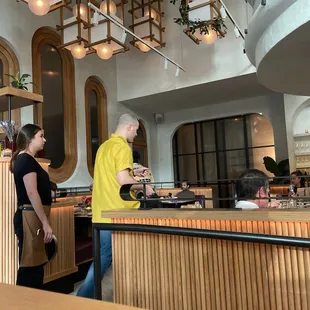 a man and a woman in a restaurant