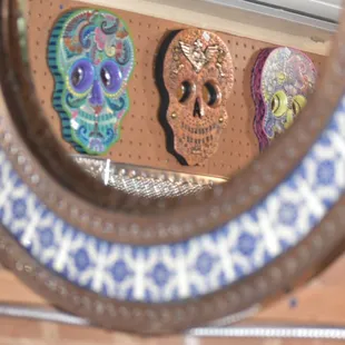 a mirror with skulls on it