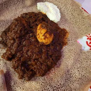 Doro Wat on cold injera bread