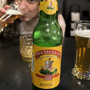 a woman drinking a beer