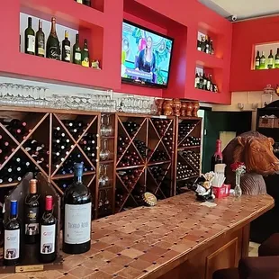 a bar with wine bottles