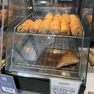 a display case filled with baked goods