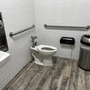 a toilet and sink in a public restroom