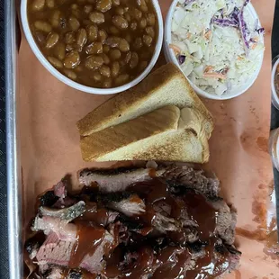 Sliced brisket, cole slaw and baked beans