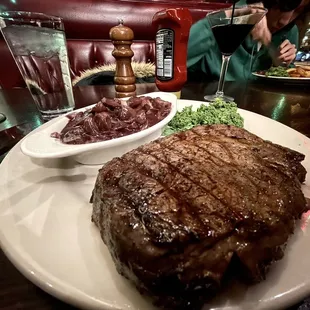 16 oz flame broiled rib-eye with a side of mushrooms in burgundy sauce. The raw kale should&apos;ve had a greater purpose than garnish to me?