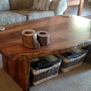 Top view of coffee table, showing curved live edge on outside.  Live edge on sofa side is not curved.  Love it!  Lifetime guarantee, too.