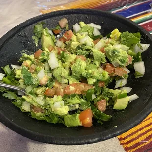 Fresh guacamole; mixed right at your table with the ingredients you choose!