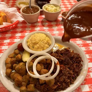 Shredded Brisket, fried okra, and potato salad. Bbq sauce smothering going on...
