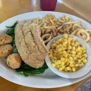 Fried catfish with hush puppies, sweet corn &amp; curly fries.
