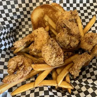 a basket of fried chicken and french fries