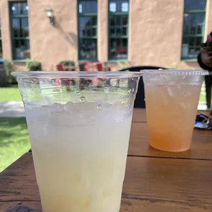 two drinks on a table outside