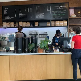 a woman standing at a counter