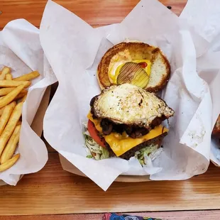 Left to right: fries (comes with a combo); Messi Burger w/ egg, bacon, and mushroom; Memphis BBQ wings