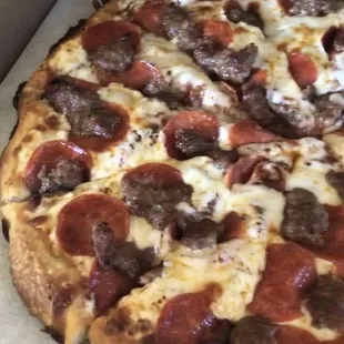 Large pepperoni and sausage. Screenshots from a video taken at pickup. 02-23-21