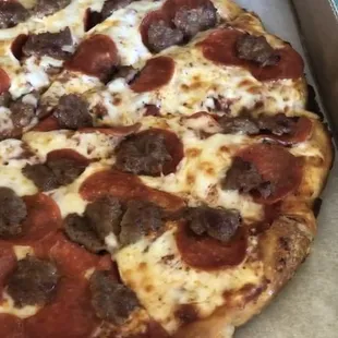 Large pepperoni and sausage. Screenshots from a video taken at pickup. 02-23-21