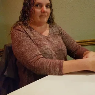 a woman sitting at a table