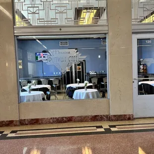 a view of the restaurant through the windows