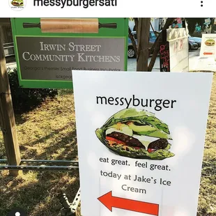 a sign with a picture of a sandwich on it