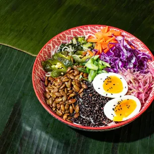 Rainbow Salad w/ Tamarind Vinagrette - red, green cabbage, vermicelli, roasted black rice, garlic chips, roasted jalapeño, jammy egg, spiced