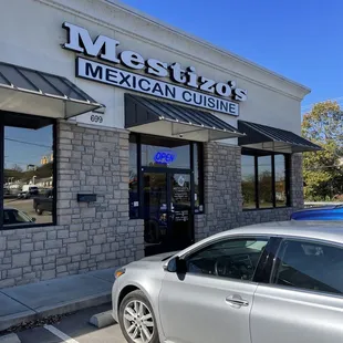 a car parked in front of the restaurant