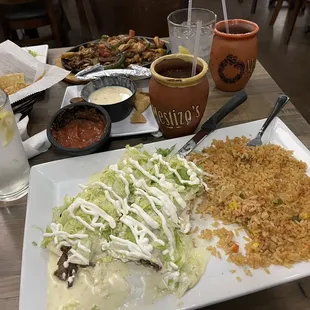 Steak burrito without pico de gallo, added lettuce, sour cream, and a side of rice.