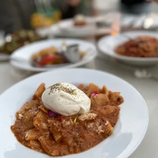 Rigatoni bolognese with burrata