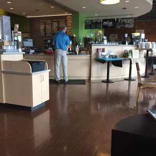 a man standing in a coffee shop