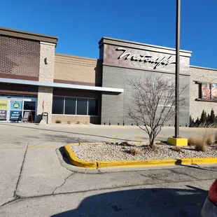 a parking lot in front of a store
