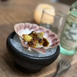 Stongington Scallop with roasted pineapple (sliced table side), spiced longaniza oil, burnt garlic ash