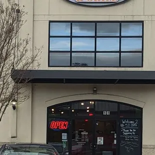 a car parked in front of the restaurant