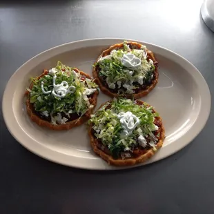 Delicious plate of 3 sopes with your choice of meat, comes with handmade tortilla, beans, onions and cilantro, lettuce, cheese, and cream.