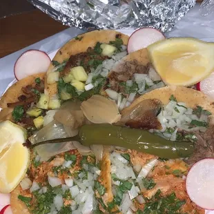 Al pastor, asada, and chicken tacos