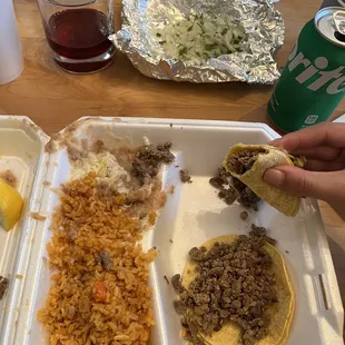 Got my onions and cilantro on the side. This is their carne asada tacos. I really liked their beans, super cheesy!