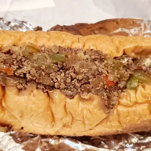 Metro Cheesesteak: With grilled onions, hot and sweet peppers, Small ($13.95)