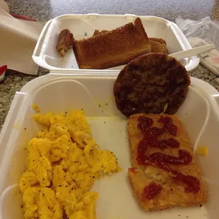 Scrambled eggs, sausage ,hash browns and toast