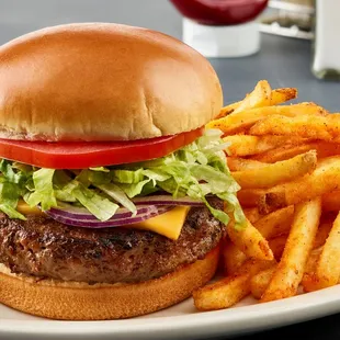 a hamburger and fries on a plate