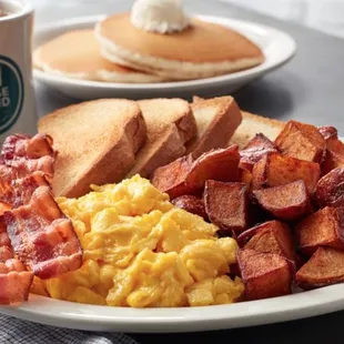 a plate of breakfast food and a cup of coffee