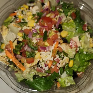 a salad in a plastic bowl