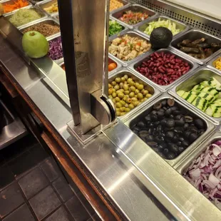 a variety of salads in trays