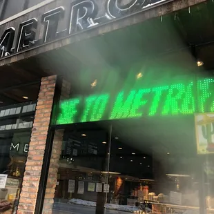 a neon sign in the window