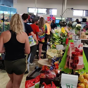 This is the line for self checkout at this Metromart!  No checkers, store is dirty and run down, empty shelves.  PLEASE, someone rescue us!