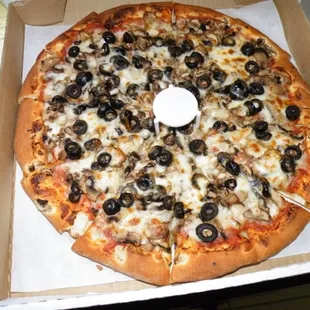 Medium olive and mushroom pizza. Perfect meal for Sunday football games :)