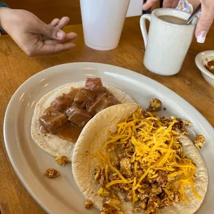 a plate of tacos and a cup of coffee