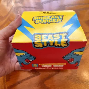 a hand holding a box of beast stuff
