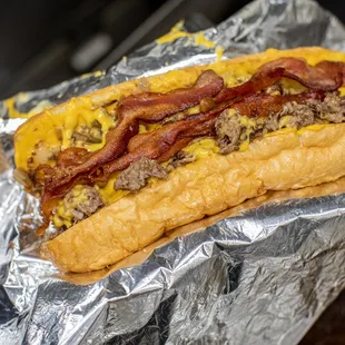a person holding a hot dog