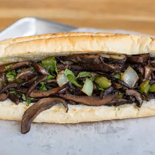 a sandwich with mushrooms and onions