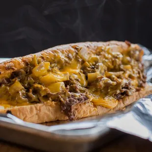 a hot dog with cheesesteaks